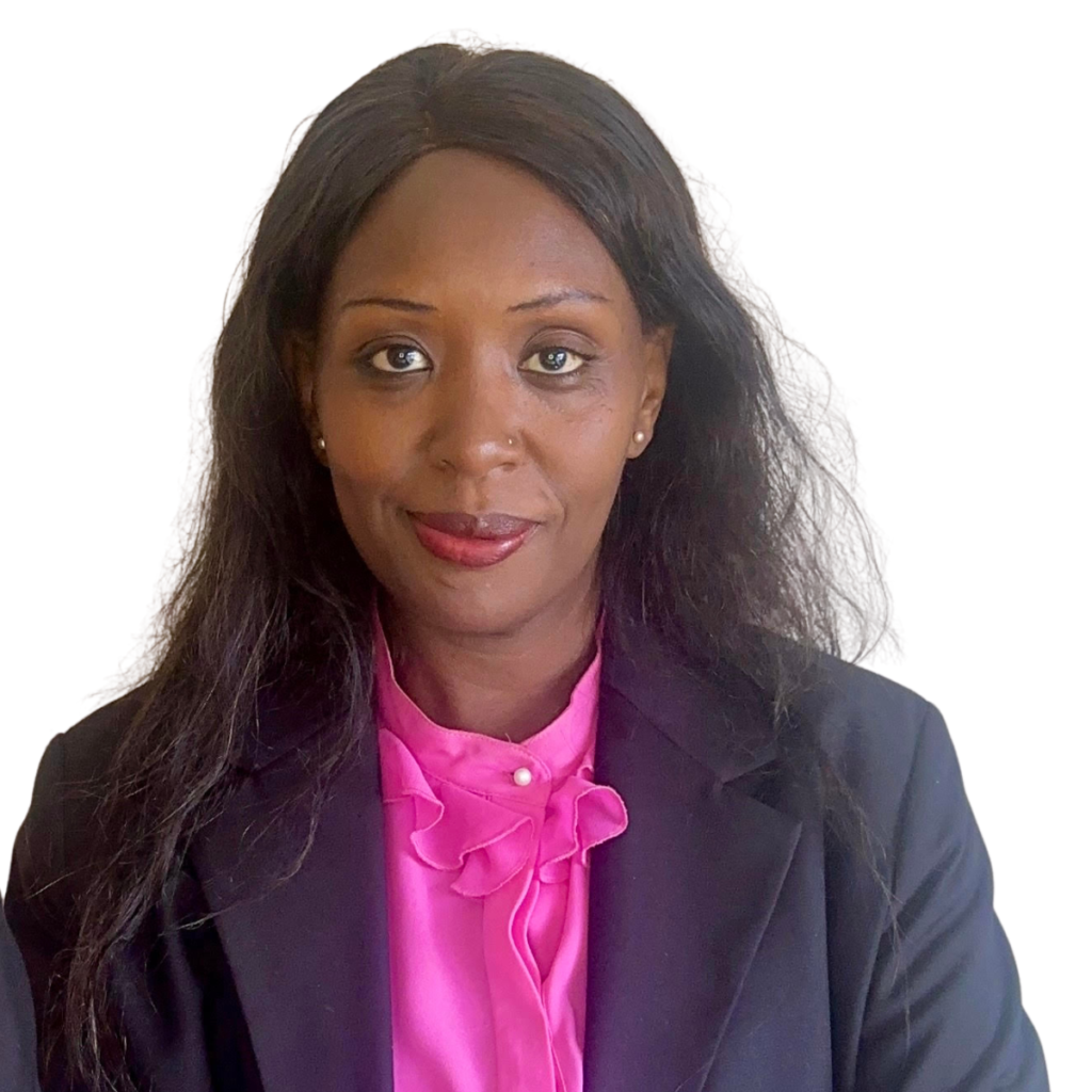 Lydia Kamau (1) Professional woman portrait, smiling, in a pink blouse and dark blazer (head and shoulders).